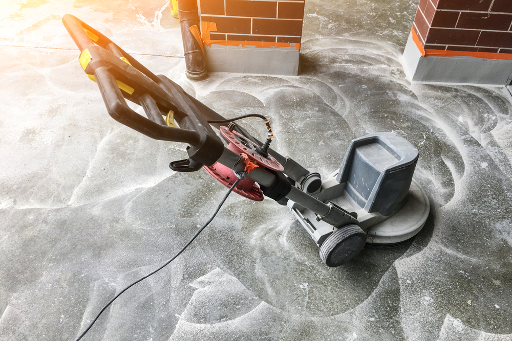 vacuuming floor after sanding process